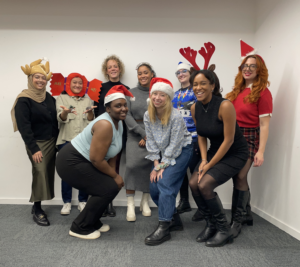 colour photograph of Heard team members in festive attire for the end of year celebration